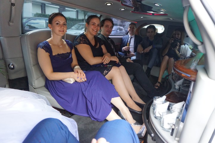 Five guests and the photographer in the limousine