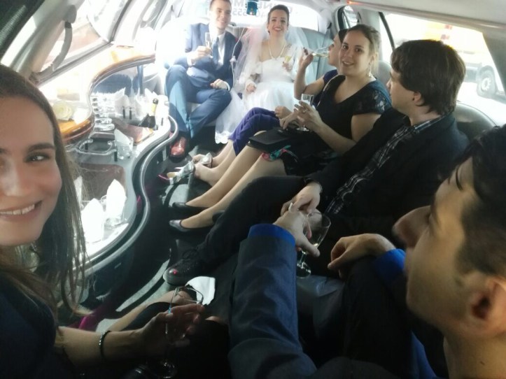 The bridal couple and its clique partying in the limousine