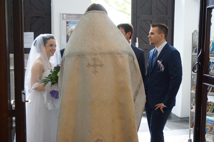 Bride and groom waiting in the anteroom for the priest to pick them up