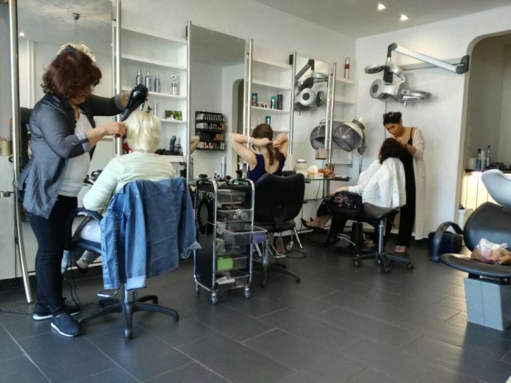 Bride-mother, bridesmaid and bride getting ready for the wedding.