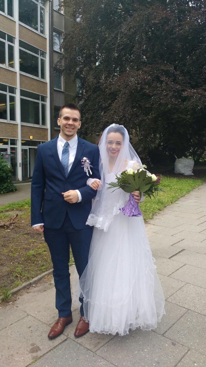 Bride and groom in front of the registry office