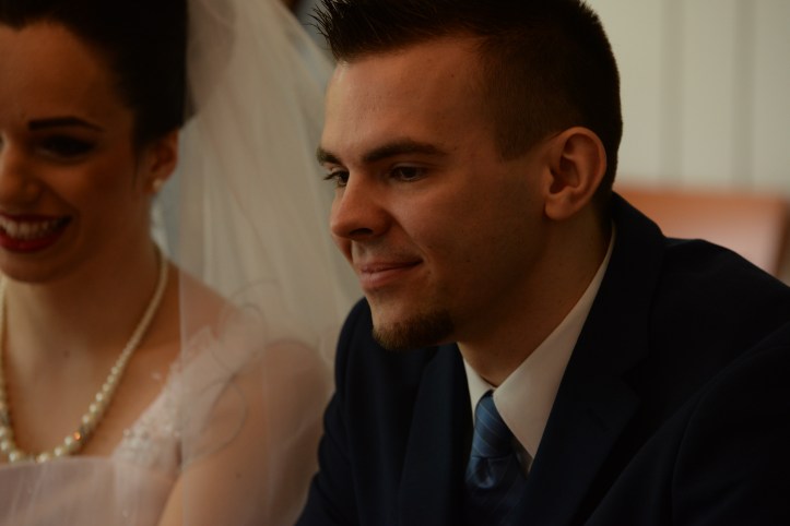 The groom thoughtful but happy