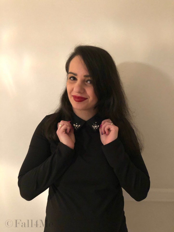 A little black dress with silver details and red lips