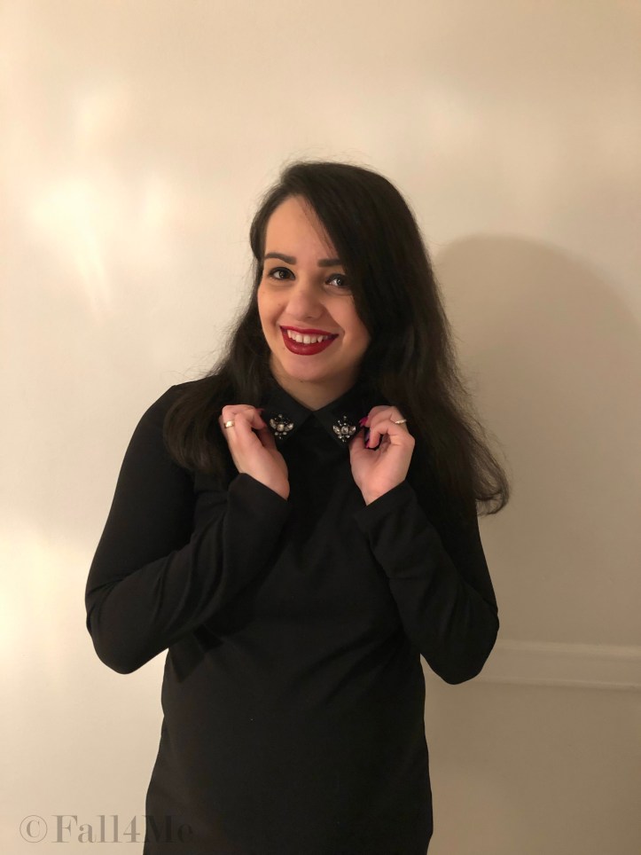 A little black dress with silver details and red lips