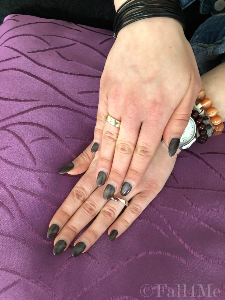 A ray of light on a black background seems like starlight on nails