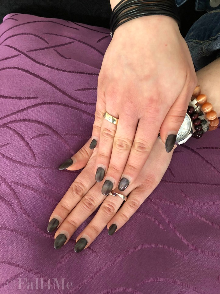 A ray of light on a black background seems like starlight on nails