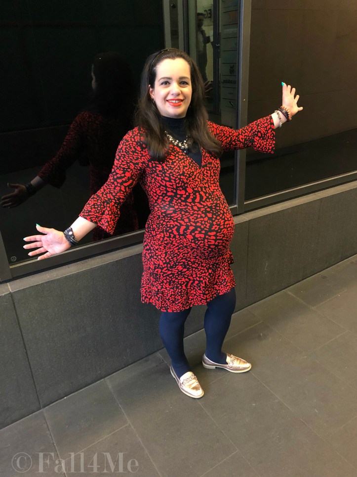 An orange dress worn with navy blue accents