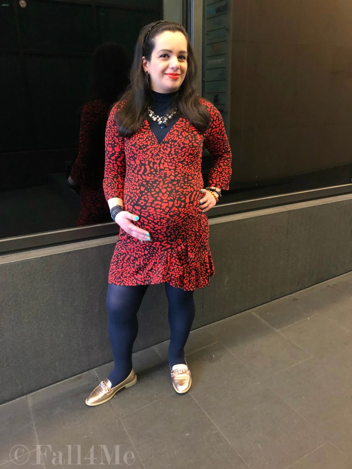 An orange dress worn with navy blue accents