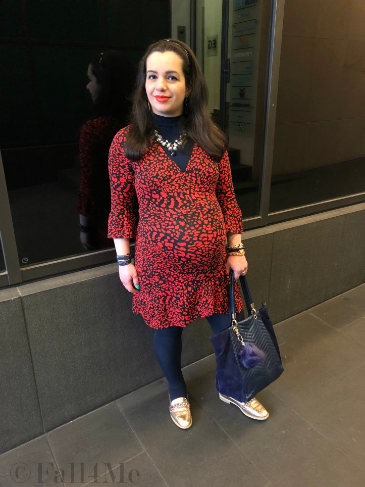 An orange dress worn with navy blue accents