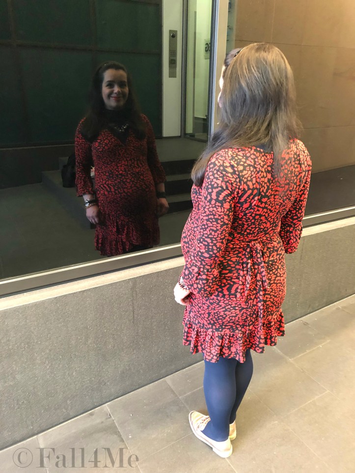 An orange dress worn with navy blue accents