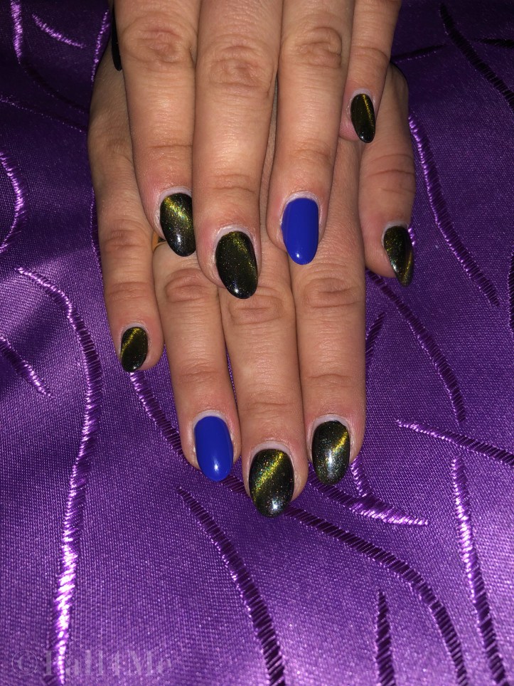 Starlight nails with one matte clear blue on the ring finger nail