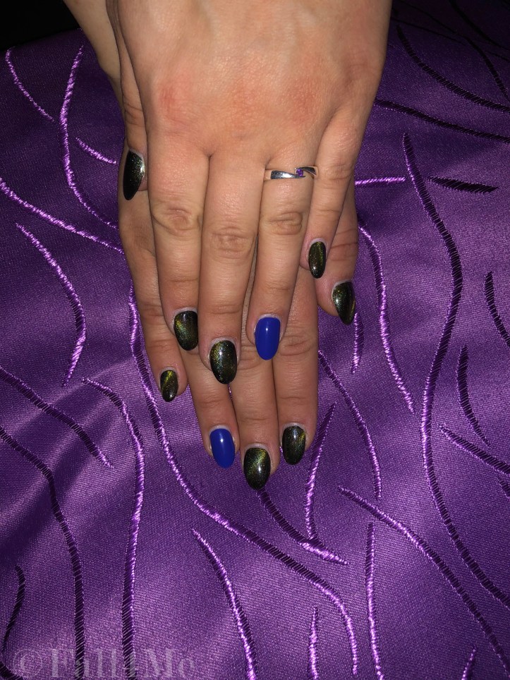 Starlight nails with one matte clear blue on the ring finger nail