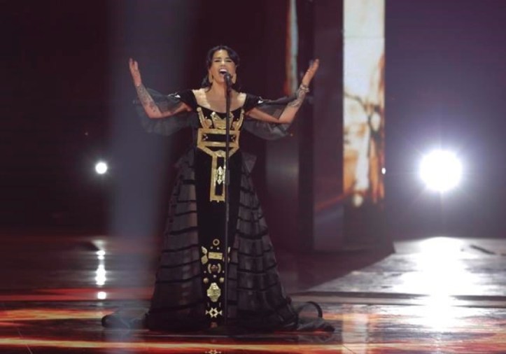 The Albanian representative in her folklore outfit on the stage.