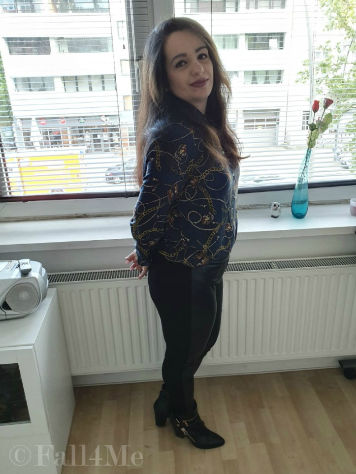 Trendy office chic: A trendy blouse with skinny black pants and boots.