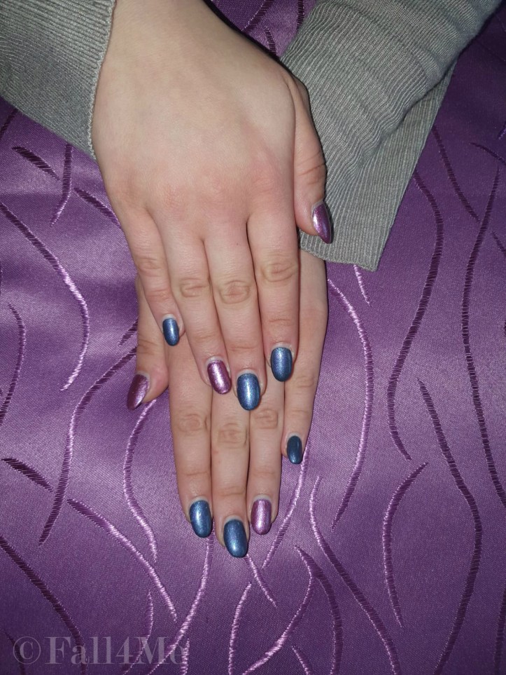 Metallic glittery nails in purple and magenta.