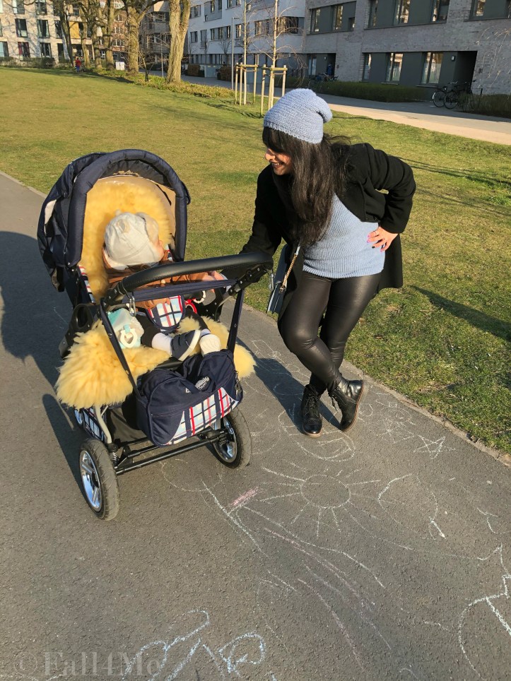 Steel-blue knit mixed with black leather and wool.