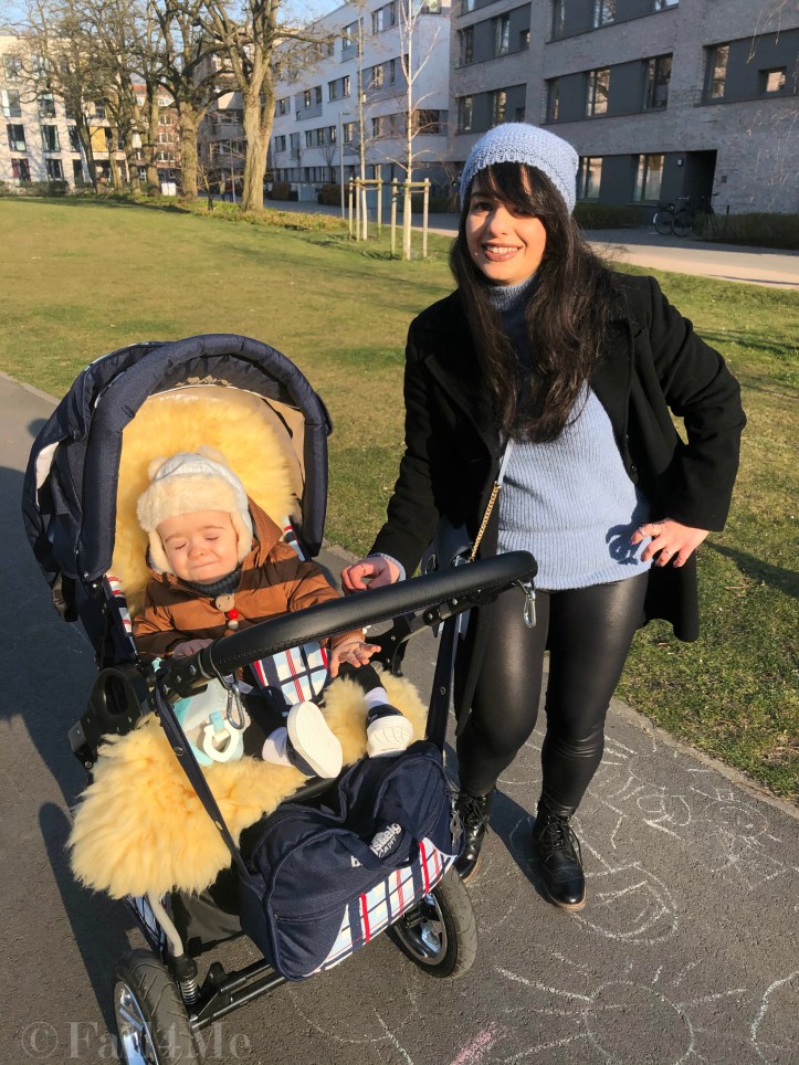 Steel-blue knit mixed with black leather and wool.