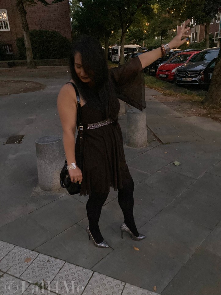 A brown asymmetric disco dress in chiffon combined with silver glitter.