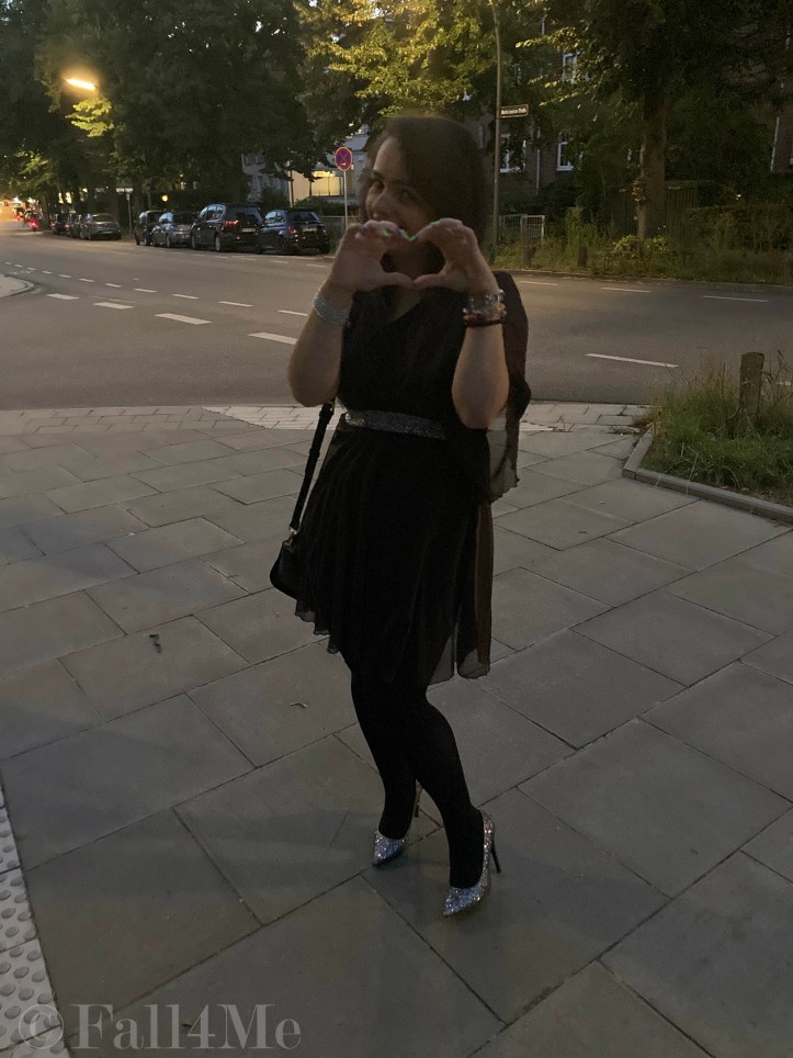 A brown asymmetric disco dress in chiffon combined with silver glitter.