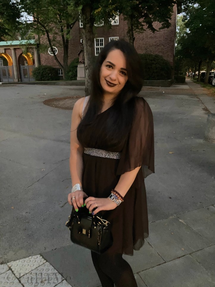 A brown asymmetric disco dress in chiffon combined with silver glitter.