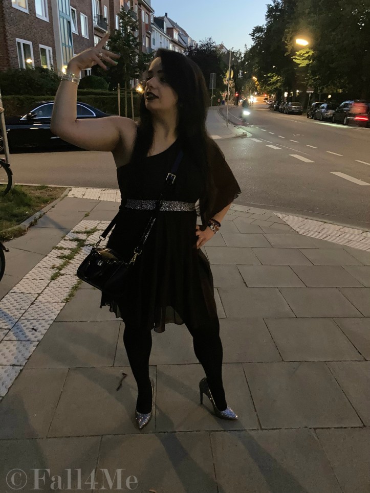 A brown asymmetric disco dress in chiffon combined with silver glitter.