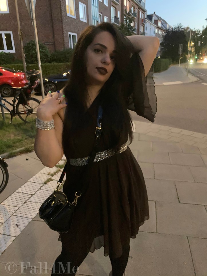 A brown asymmetric disco dress in chiffon combined with silver glitter.