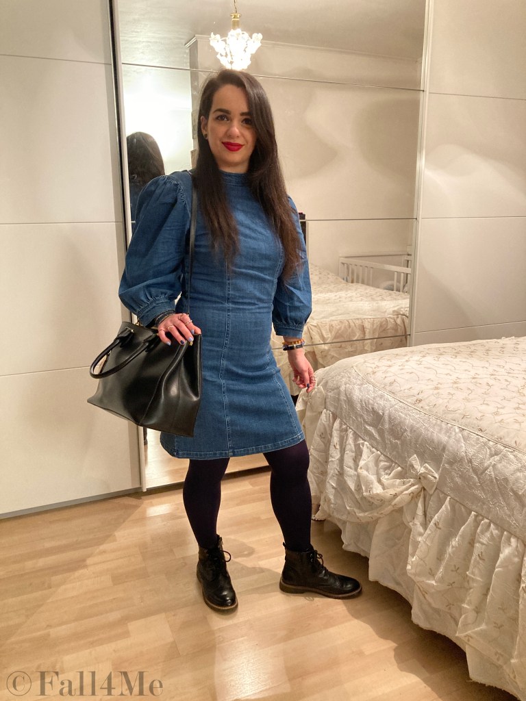 A denim dress with balloon sleeves combined with blue tights and combat boots.