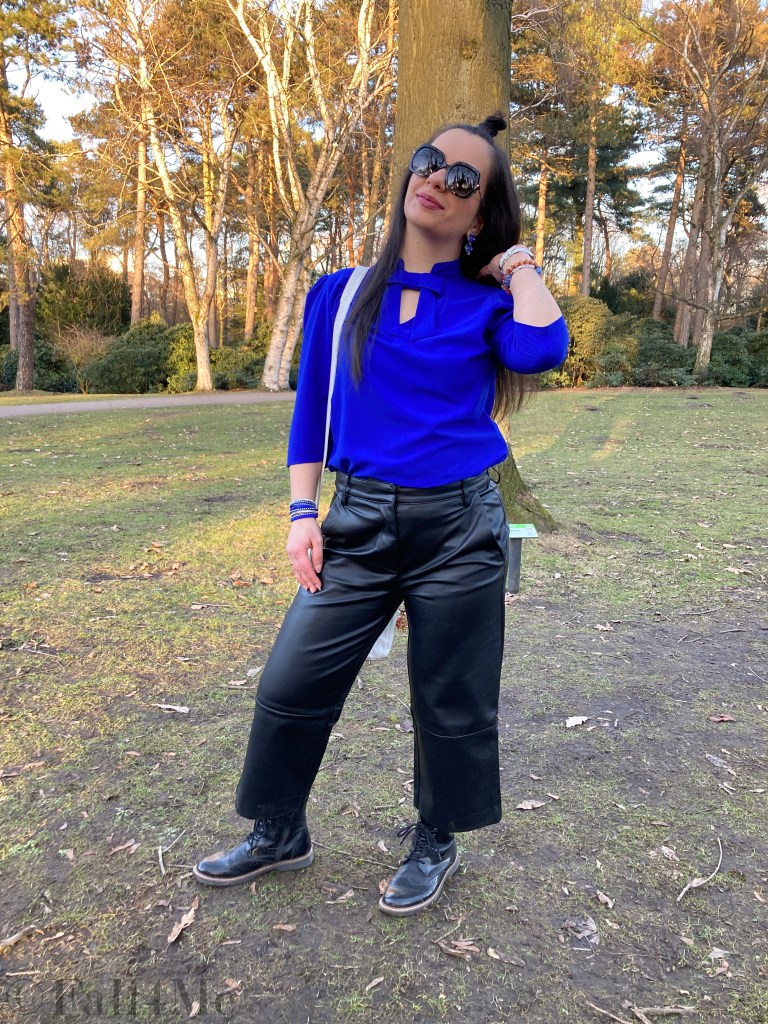 The trademark blouse by Tallinn Dolls worn with a faux-leather culotte and combat boots.