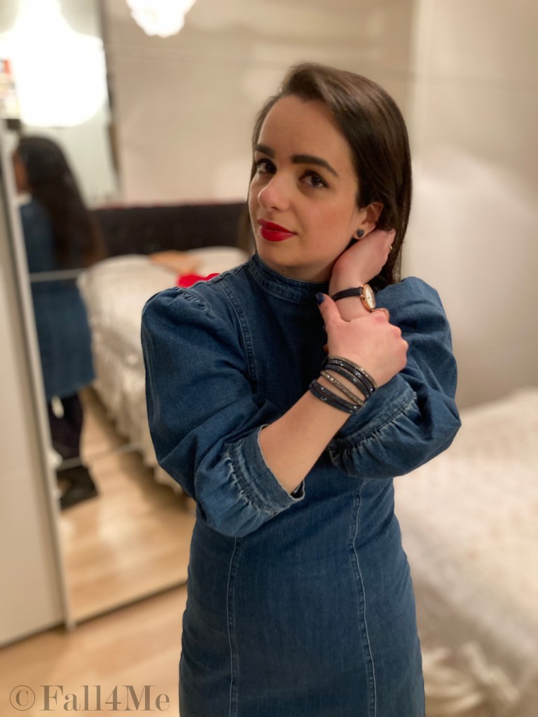 A denim dress with balloon sleeves combined with blue tights and combat boots.