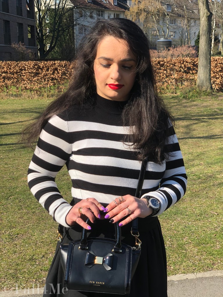 Black and white worn with a red accent and block heels.