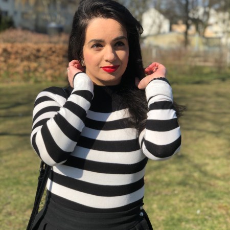 Black and white worn with a red accent.