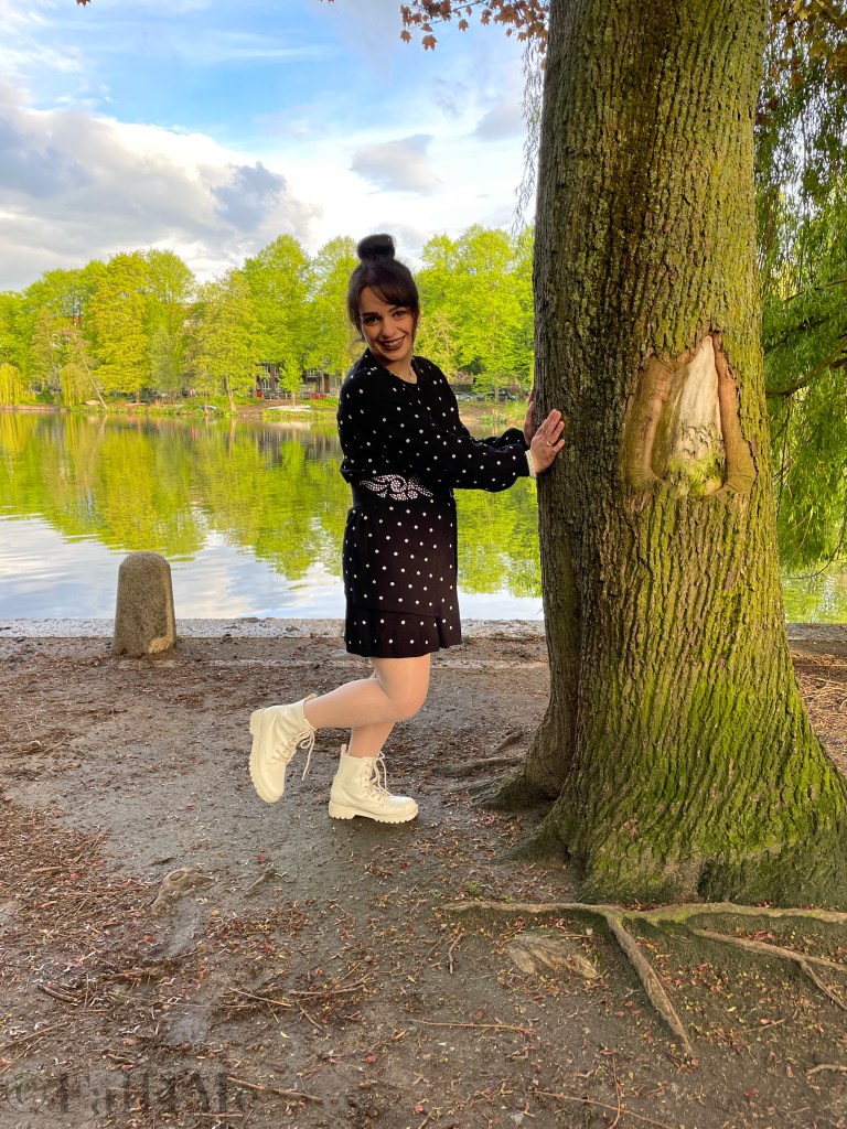Oversized style in knit with pearls matched in a black and white look with polka dots.