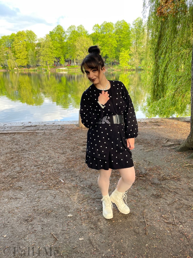 Oversized style in knit with pearls matched in a black and white look with polka dots.