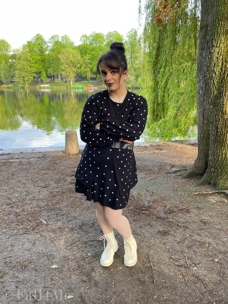 Oversized style in knit with pearls matched in a black and white look with polka dots.