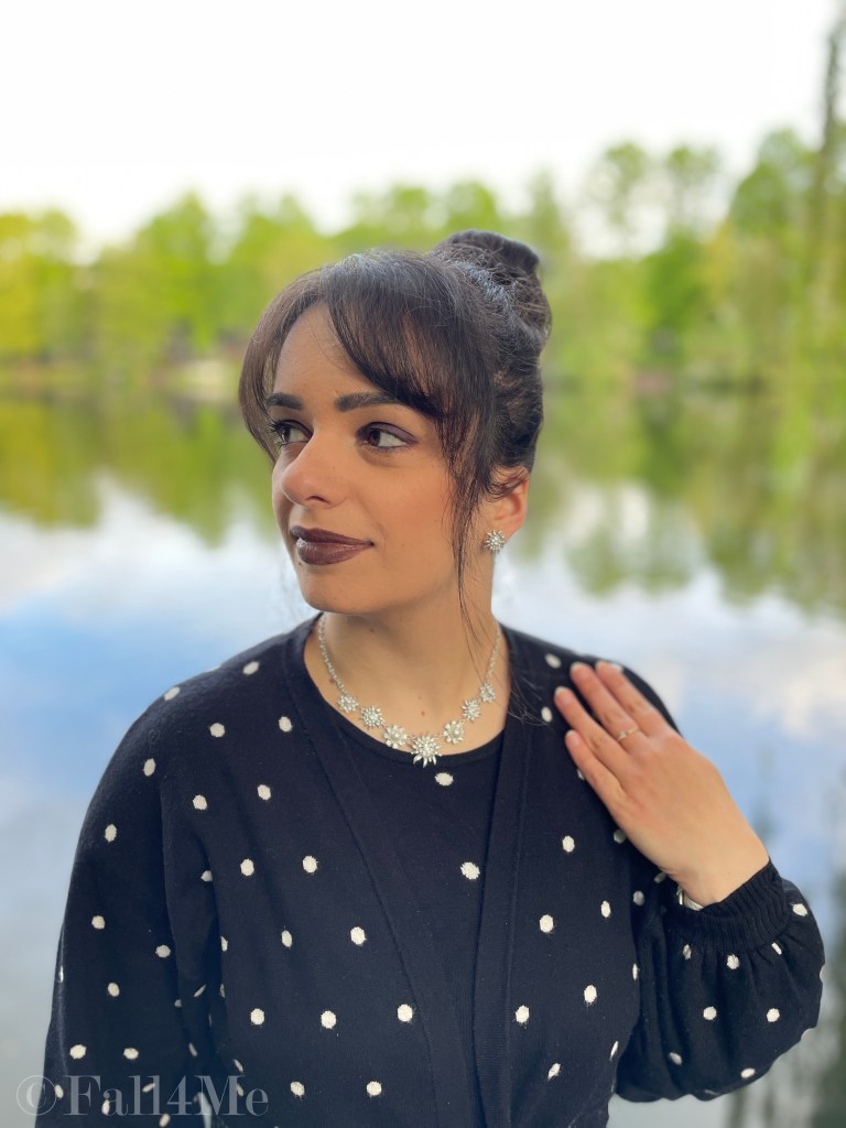 Oversized style in knit with pearls matched in a black and white look with polka dots.