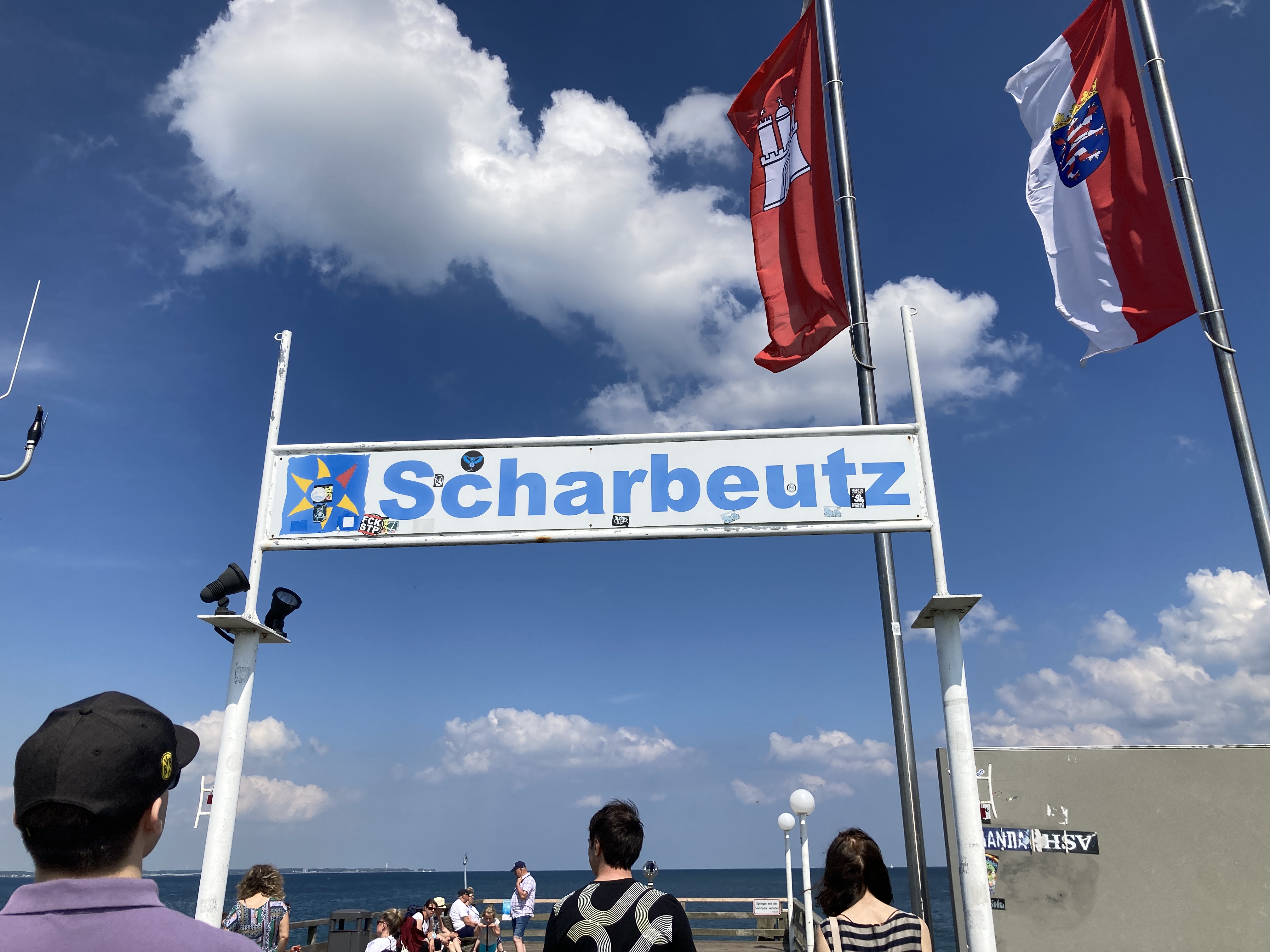 A banner with "Scharbeutz" the name on the beach, on it.