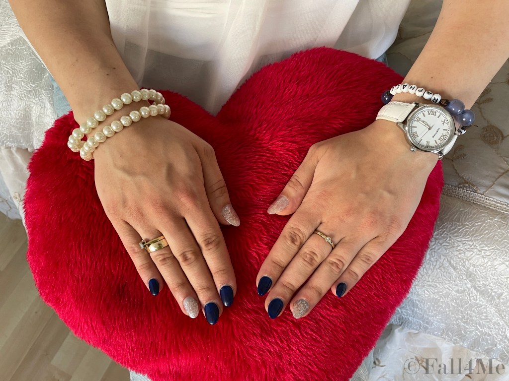 Nail art in navy and metallic.