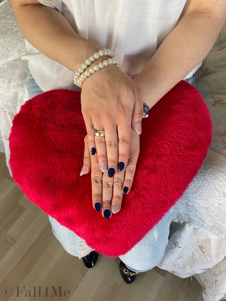 Nail art in navy and metallic.