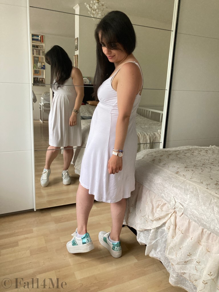 Batik and knit combined with white sneakers and a white dress.