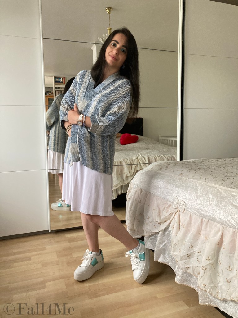 Batik and knit combined with white sneakers and a white dress.