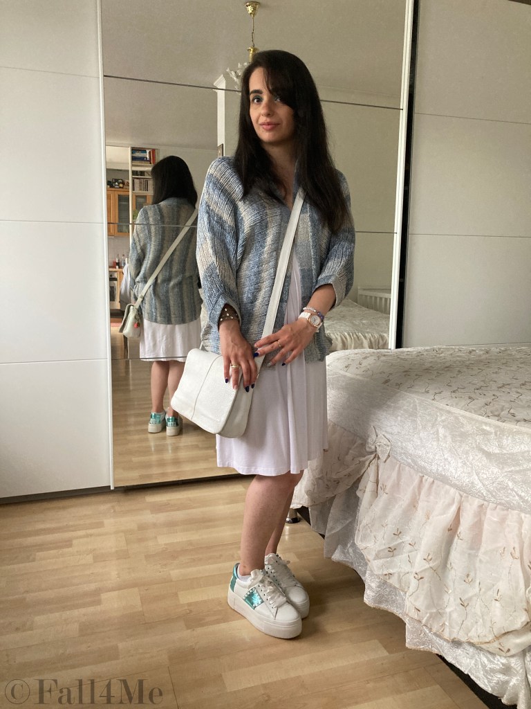 Batik and knit combined with white sneakers and a white dress.