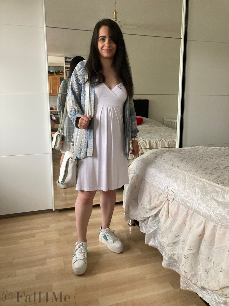 Batik and knit combined with white sneakers and a white dress.