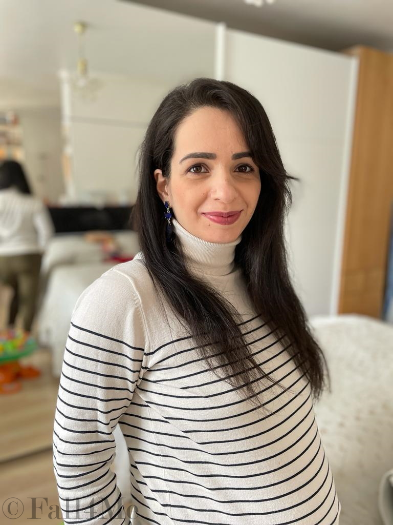 A choice of navy tops with a cream colored based, black stripes, olive green jogpants and cream colored combat boots.