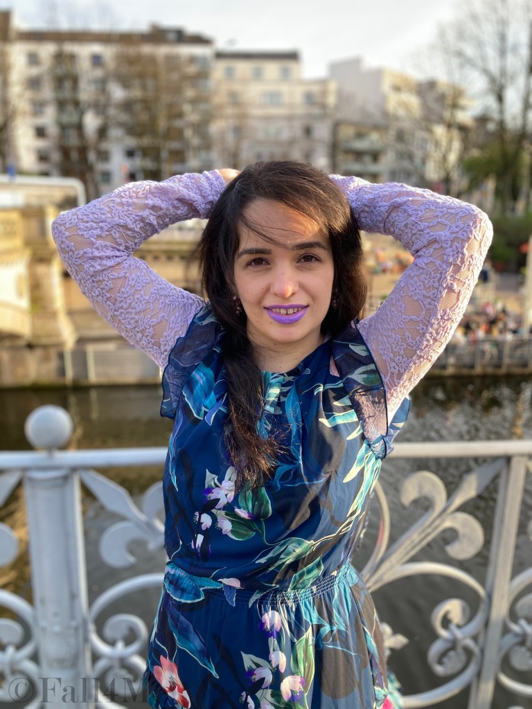 A summer dress worn over a shirt.