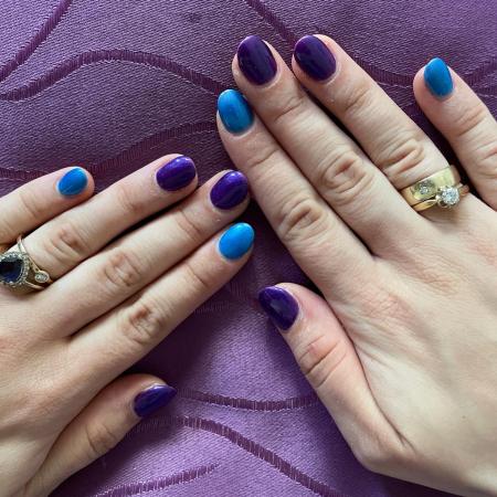 Nails in purple and cobalt blue.