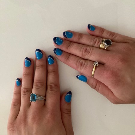 Nails in two different shades of blue with a silver line separating them.