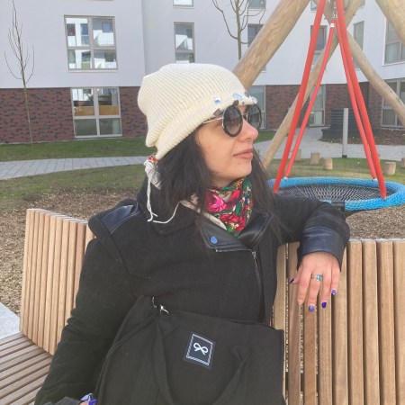 A robe-coat that looks like a dress, worn with winter-leggings, combat boots and sunglasses combined with beanies.