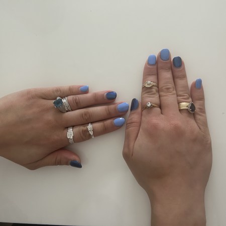 Nail art in dark blue and light blue.