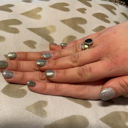 New Year's Eve nails in glittery silver and gold.