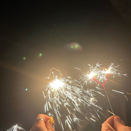 Sparklers lit on midnight.
